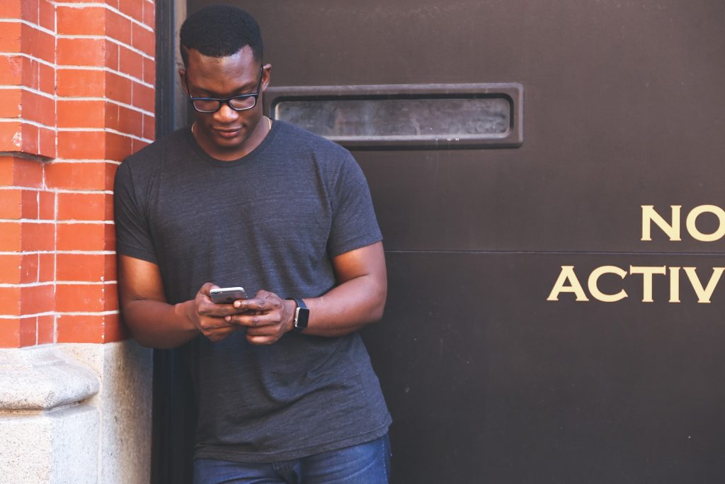 man looking at phone