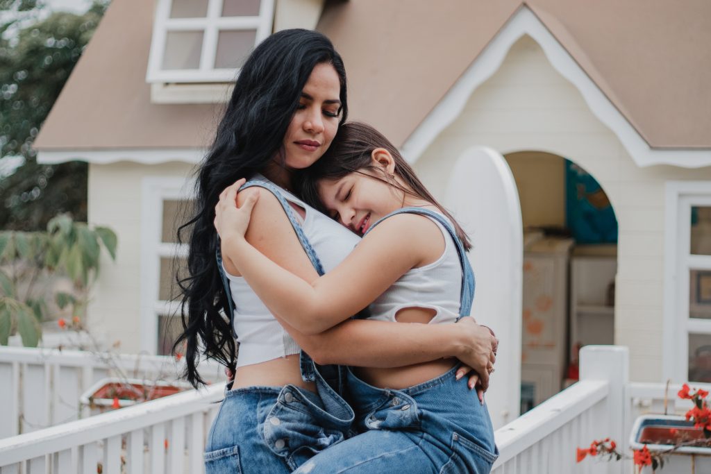 woman embracing daughter
